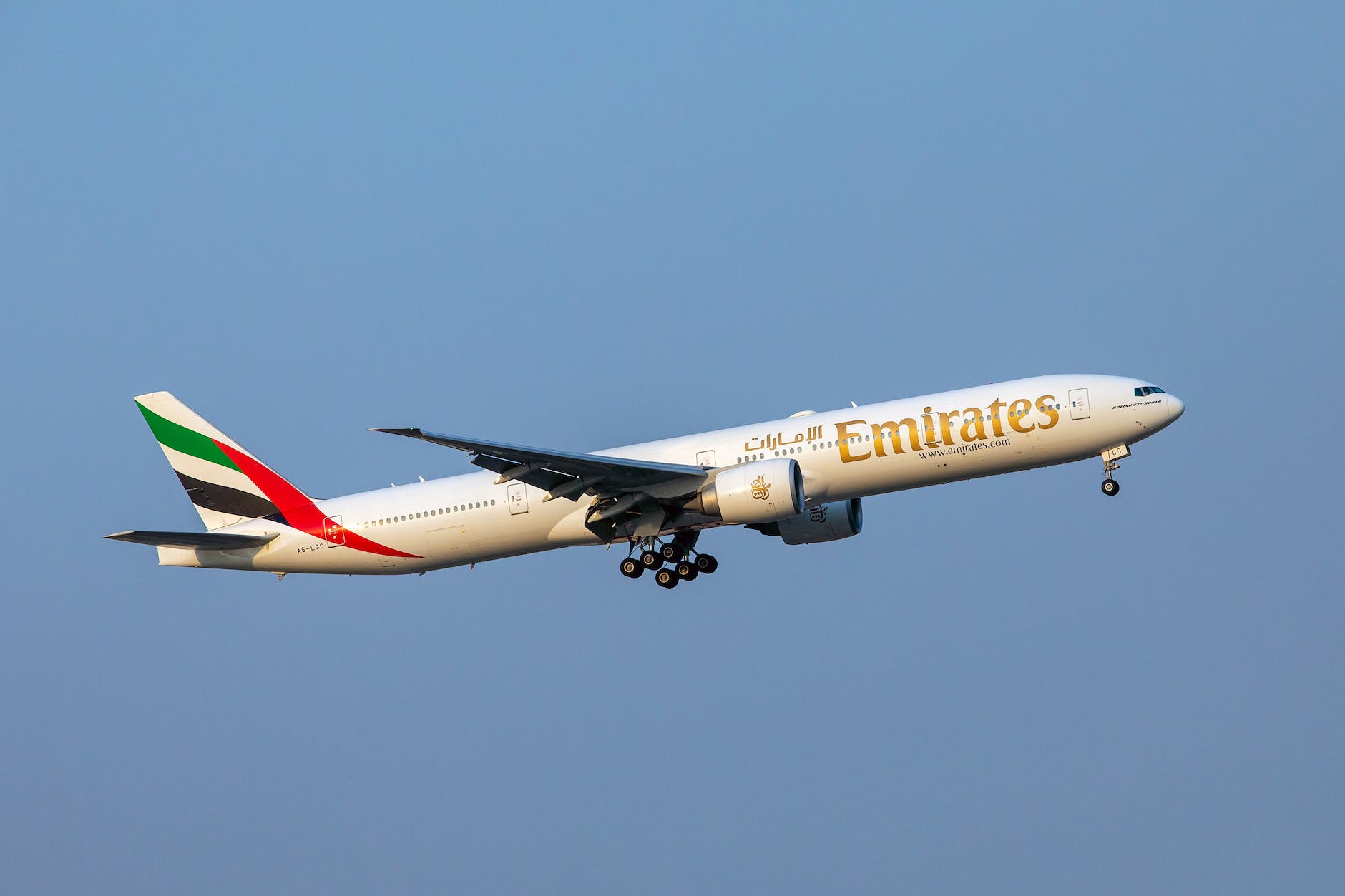 an airplane in the blue sky