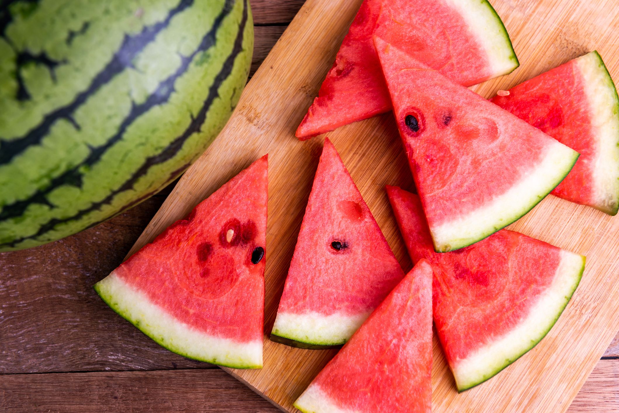 fresh ripe watermelon slices on wooden table royalty free image 1684966820