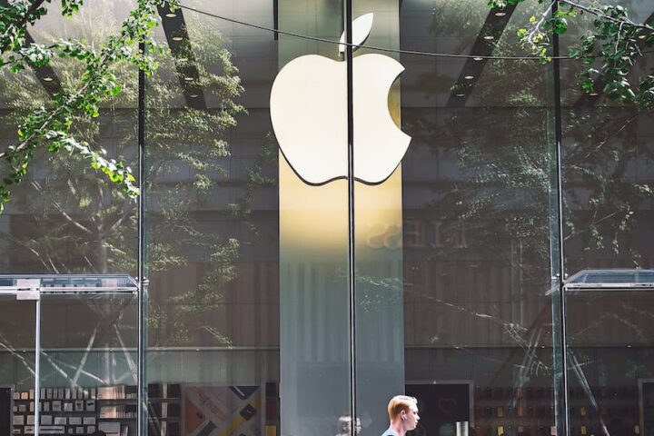 man passing an apple store